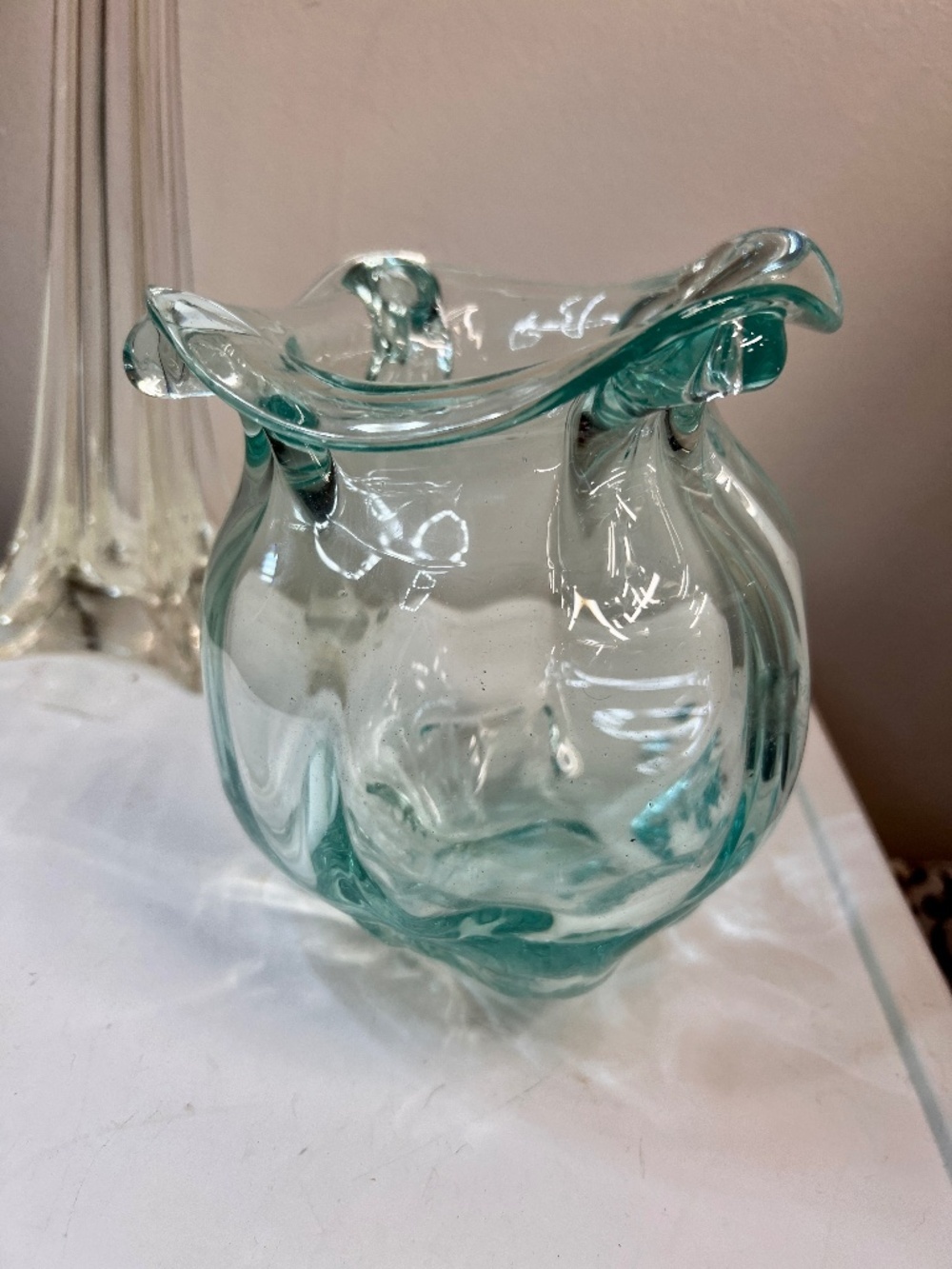 Hand-blown molten glass vase free-form ruffled rim and a translucent aqua-green
